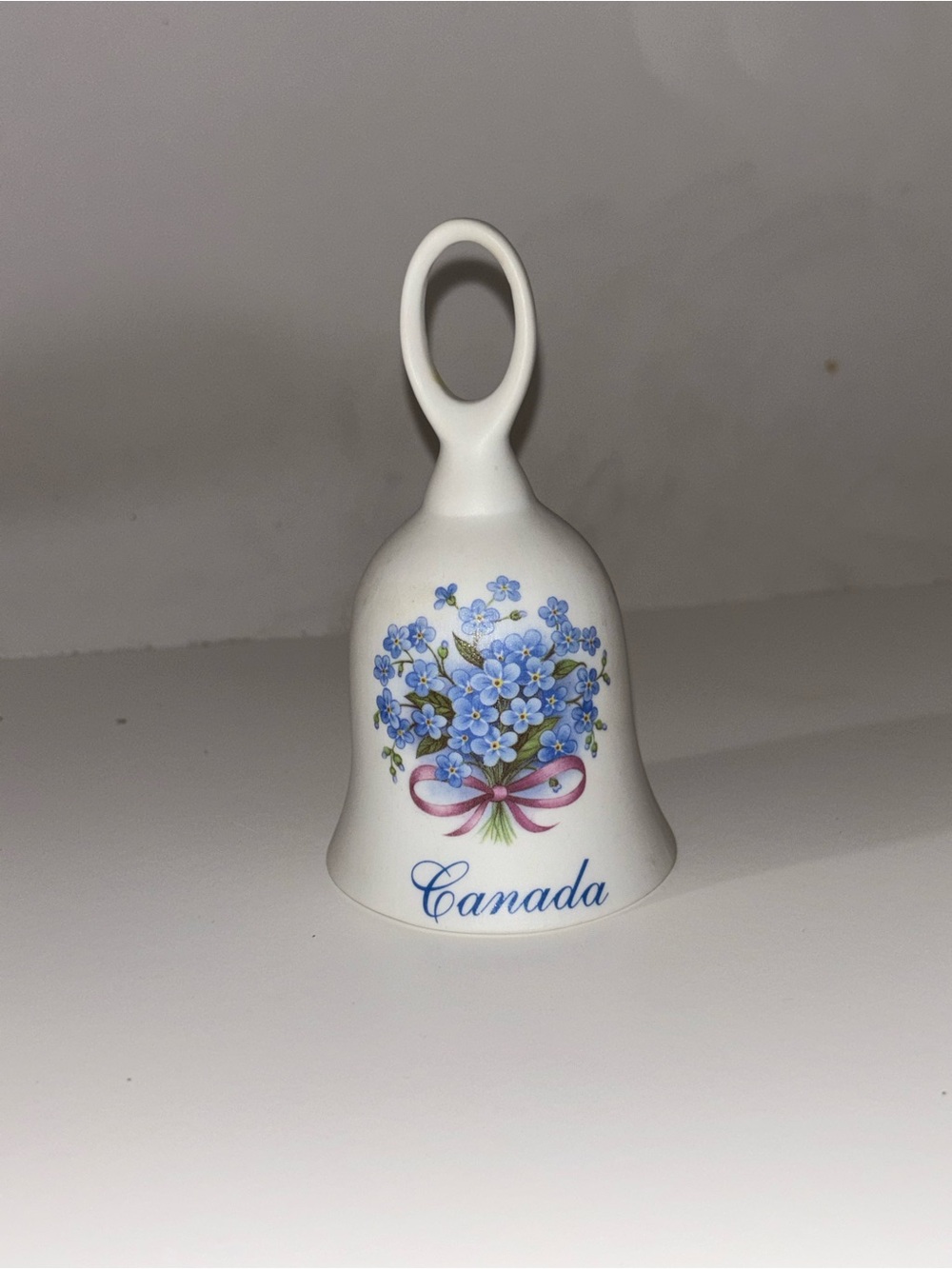 Canada Porcelain Bell with Blue Floral Bouquet